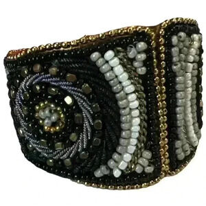 Beaded metal cuff bangle bracelet spring loaded